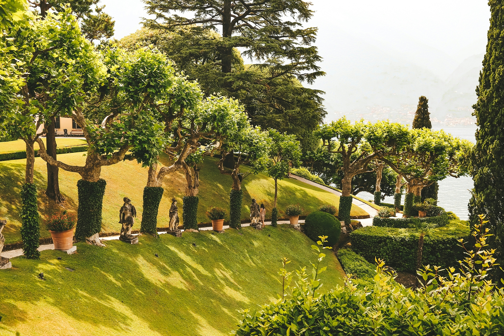 Family enjoying panoramic views from a hilltop in Lombardy countryside